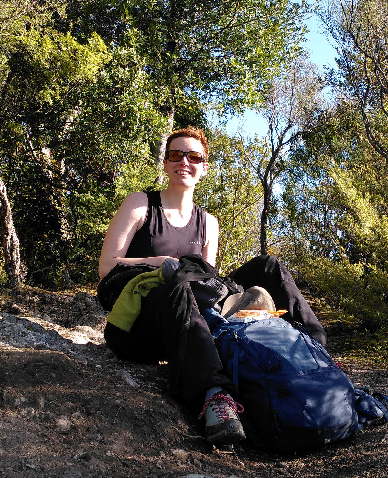 Photo of Dr Sarah Bürli in the middle of a forest